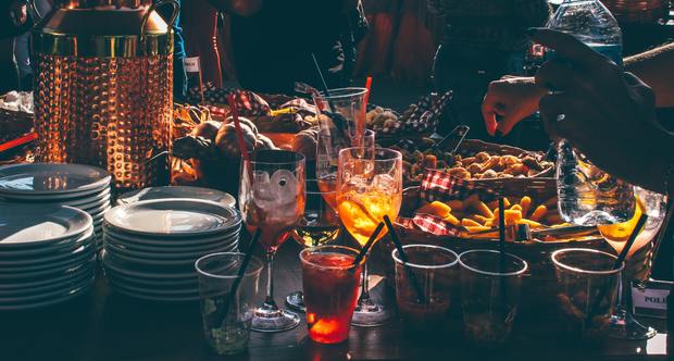 a table full of food and alcohol
