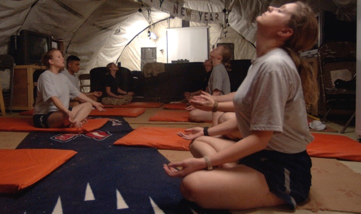 People sitting on the floor in a breathing exercise