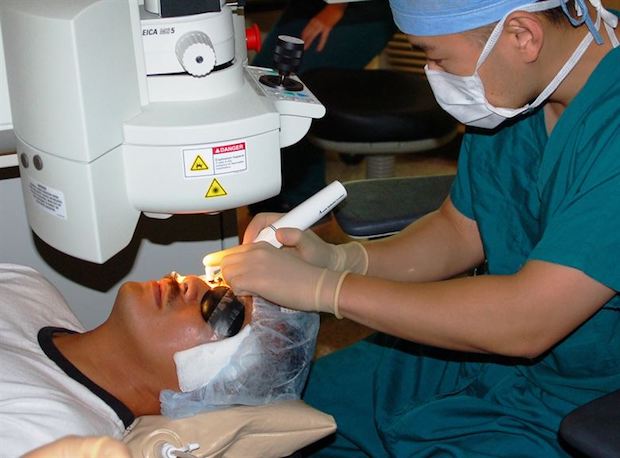 a doctor performing a laser eye surgery