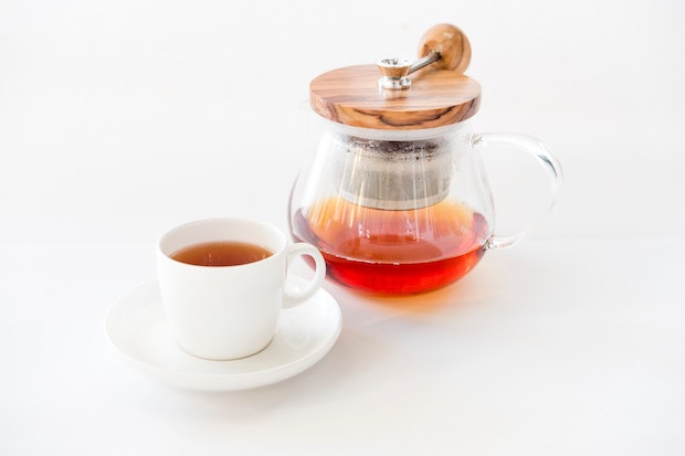 a pot of tea and a teacup