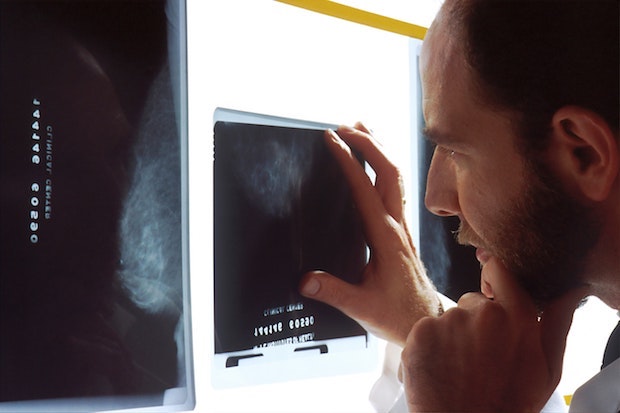 a doctor looking at an x-ray