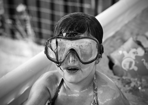 a child wearing swimming goggles